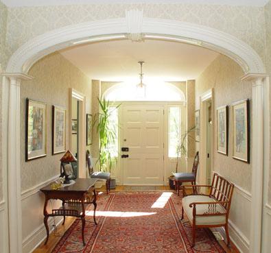 Entry Foyer 32' x 9' divided front & rear compartments by elliptical arch with slender colonnettes.