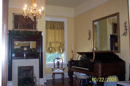 One of the twin parlors, Antique fire place tiles, some antiques could be included
