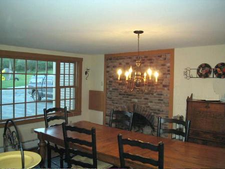 Light and airy Dinning Room with romatic  fireplace