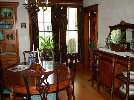 Dining Room with original maple floors, pocket doors and lovely woodwork trim