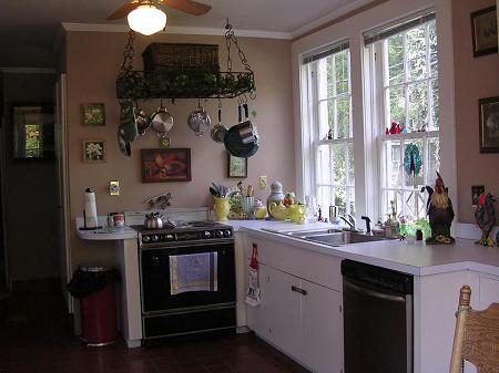 Kitchen includes Jenn-air oven with griddle grill combo, dishwasher, refrigerator and double sink.