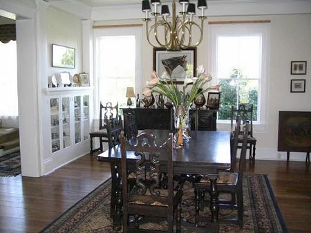 Elegant Dining Room with builtin china cabinets and wood burning fireplace