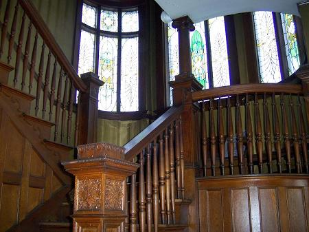 Grand Staircase with original stained glass