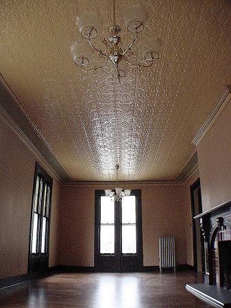 Huge Living Room with Tin Ceilings and Tiled Fireplace