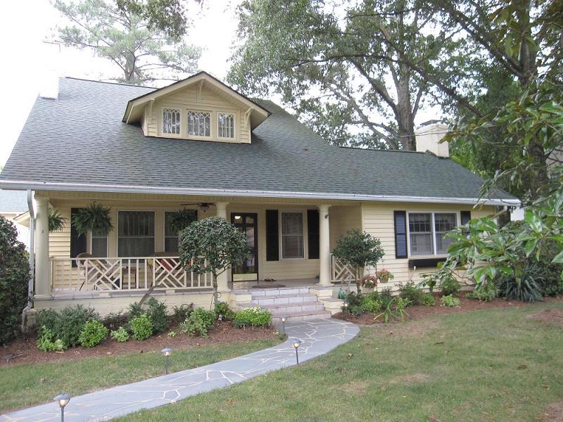 Inviting Front Porch has Tuscan Columns & Chippendale Rails