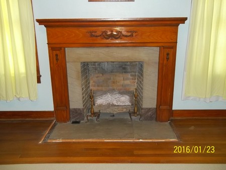 Mantel and Marble Fireplace in Large Living Room