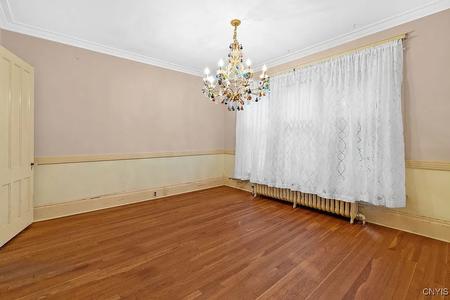 Formal dining room featuring Murano glass chandelier 